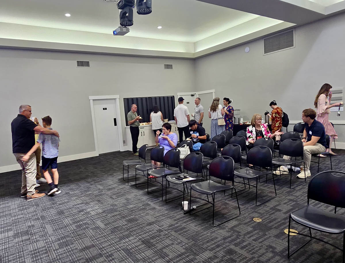 Community members gathering for fellowship after a service